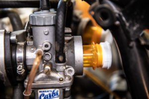 This photo shows part of the process of removing the throttle cable.
