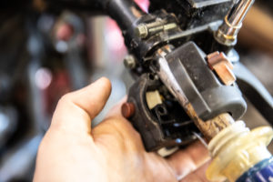 This photo shows disconnecting the throttle cable at the controls end.