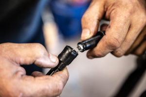 This shows exposing the inner throttle cable assembly.