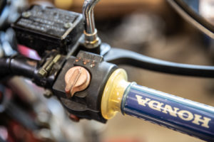 This photo shows reconnecting the cable to the throttle tube.