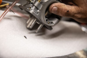 Here's removing debris under the needle seat.
